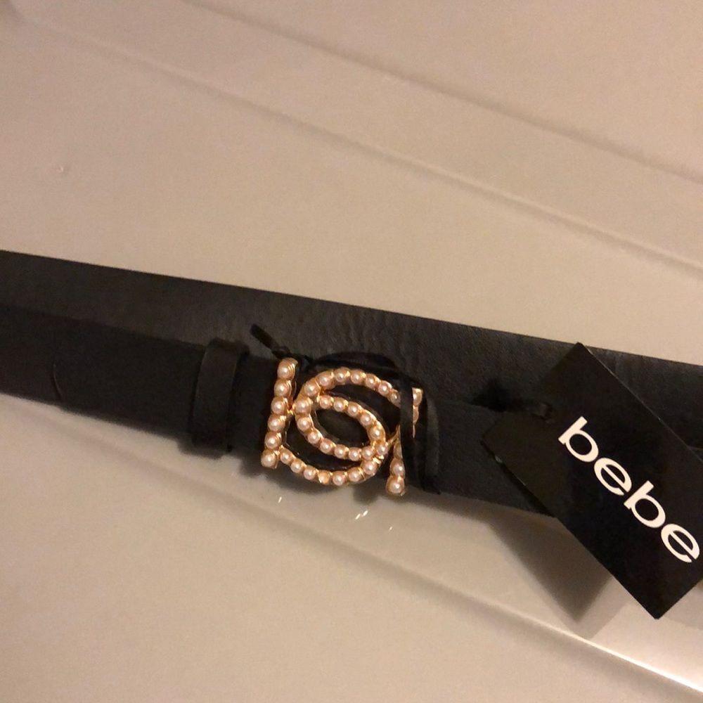 Bebe belt size medium black with gold tone buckle and pearl like NWT *flawed*